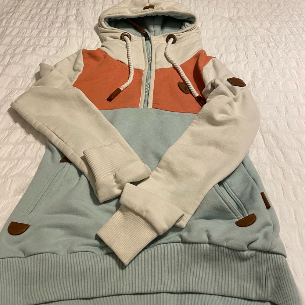 Hoodie.  Small dents in hood string as shown in picture. Very warm.